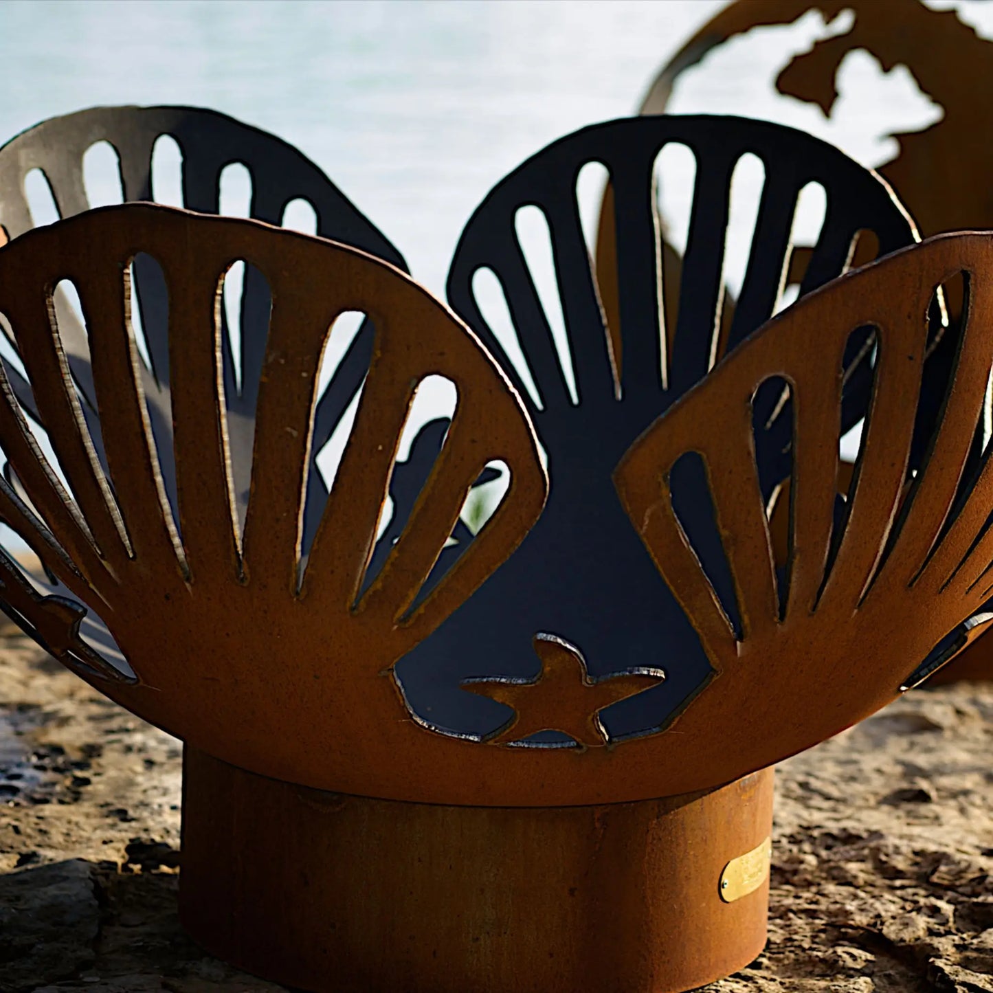 Fire Pit Art Barefoot Beach Steel Fire Pit – Shell and Starfish Design Outdoor Fire Pit – Lifestyle View