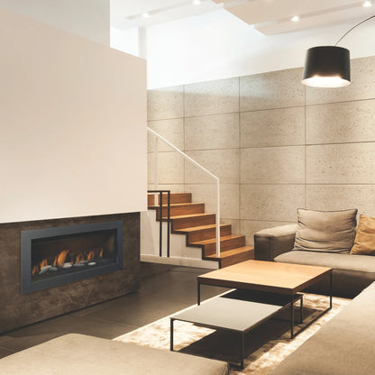 Sierra Flame linear gas fireplace built into a stone-faced wall beside a staircase in a modern living room