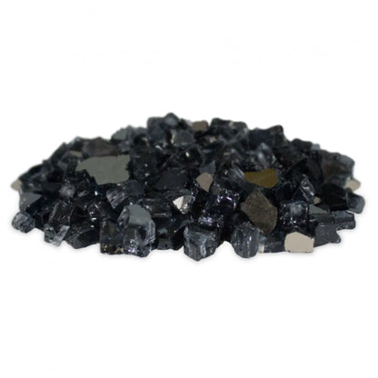 A pile of polished black glass fire stones on a plain white background.