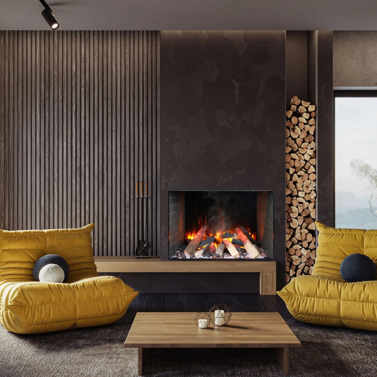 A built-in electric fireplace with orange flames set into a dark wood-paneled wall beside a vertical firewood storage slot, in a moody living room with mustard yellow cushions and navy accent pillows on a gray sofa.