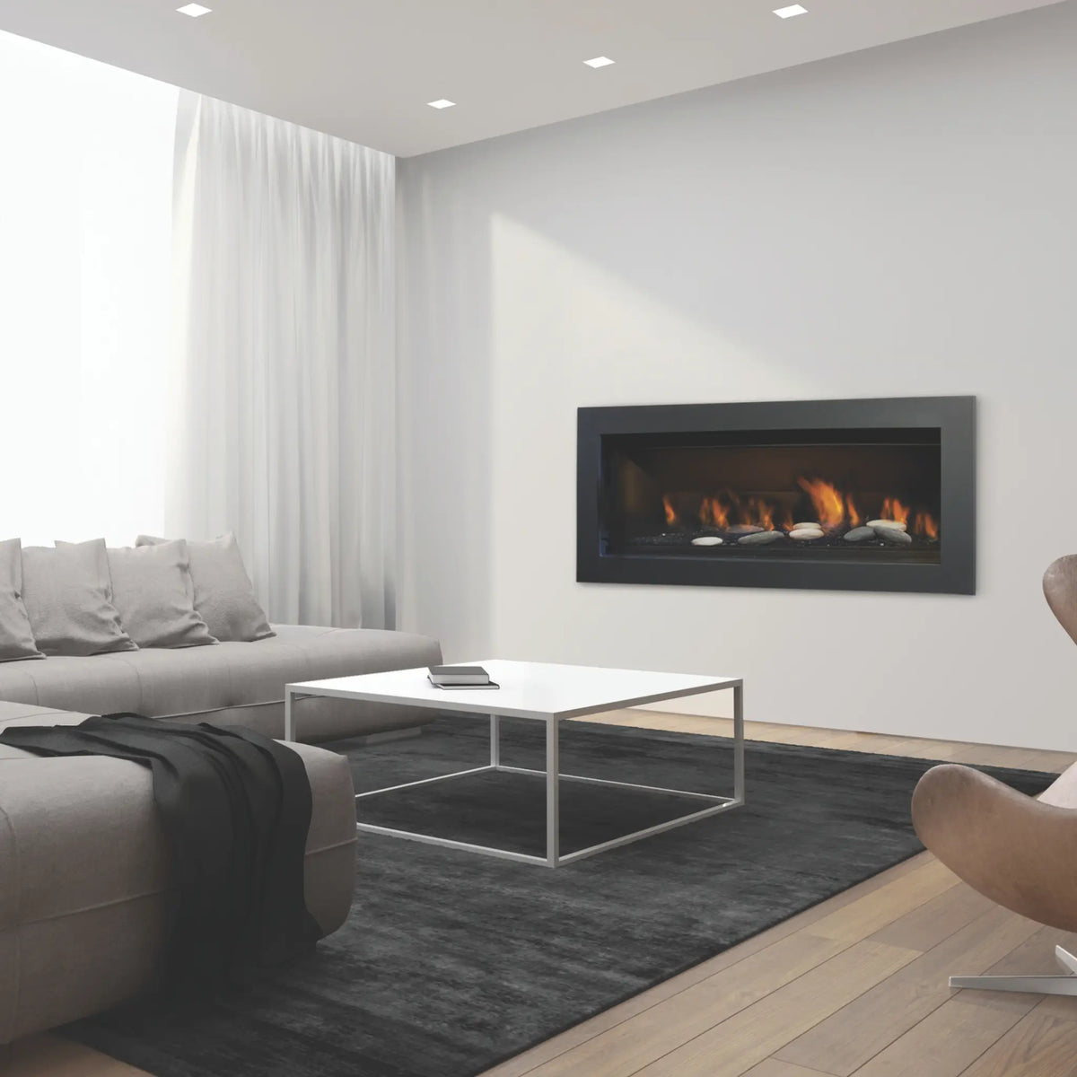 Sierra Flame Stanford 55 direct vent gas fireplace with river stones in a bright modern living room