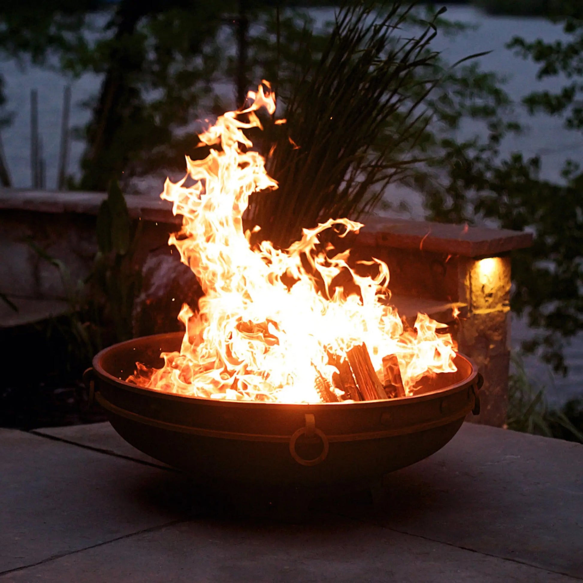 Fire Pit Art Emperor Steel Fire Pit – Medieval Riveted Design Outdoor Wood Burning Fire Pit – Lifestyle View