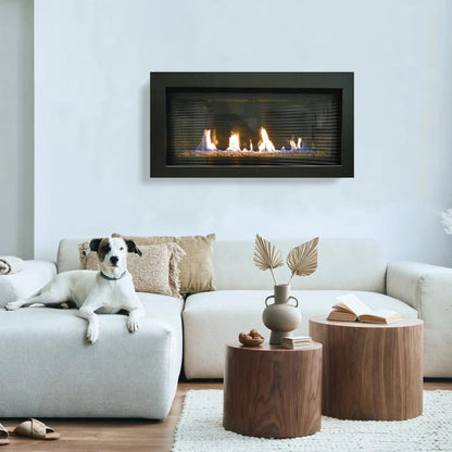 Sierra Flame Bennett 45 linear gas fireplace with black surround on a pale wall above a cream sofa