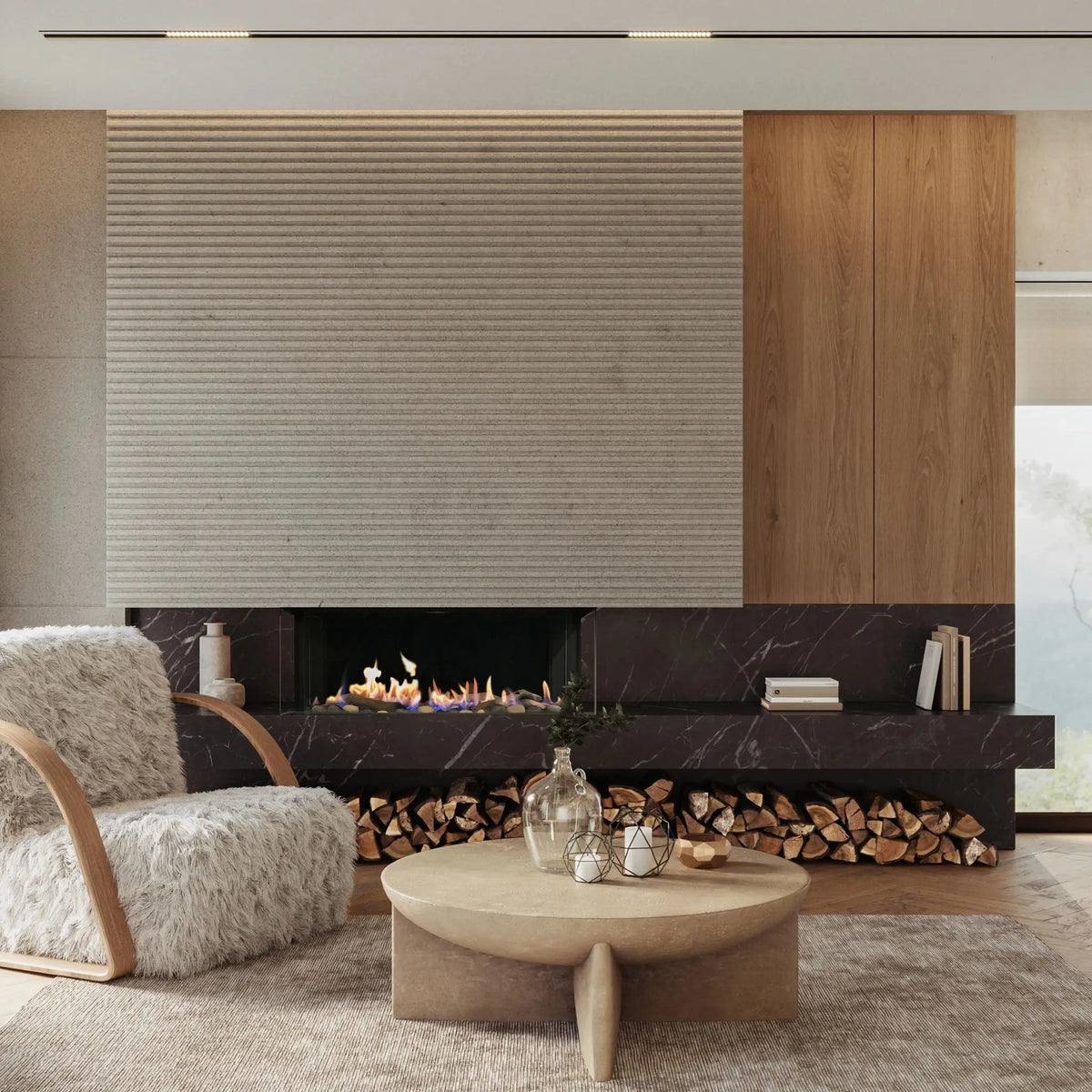 A modern living room interior featuring a large textured beige wall panel, a dark marble fireplace with visible wood logs, a round light wood coffee table, and a fluffy white armchair.