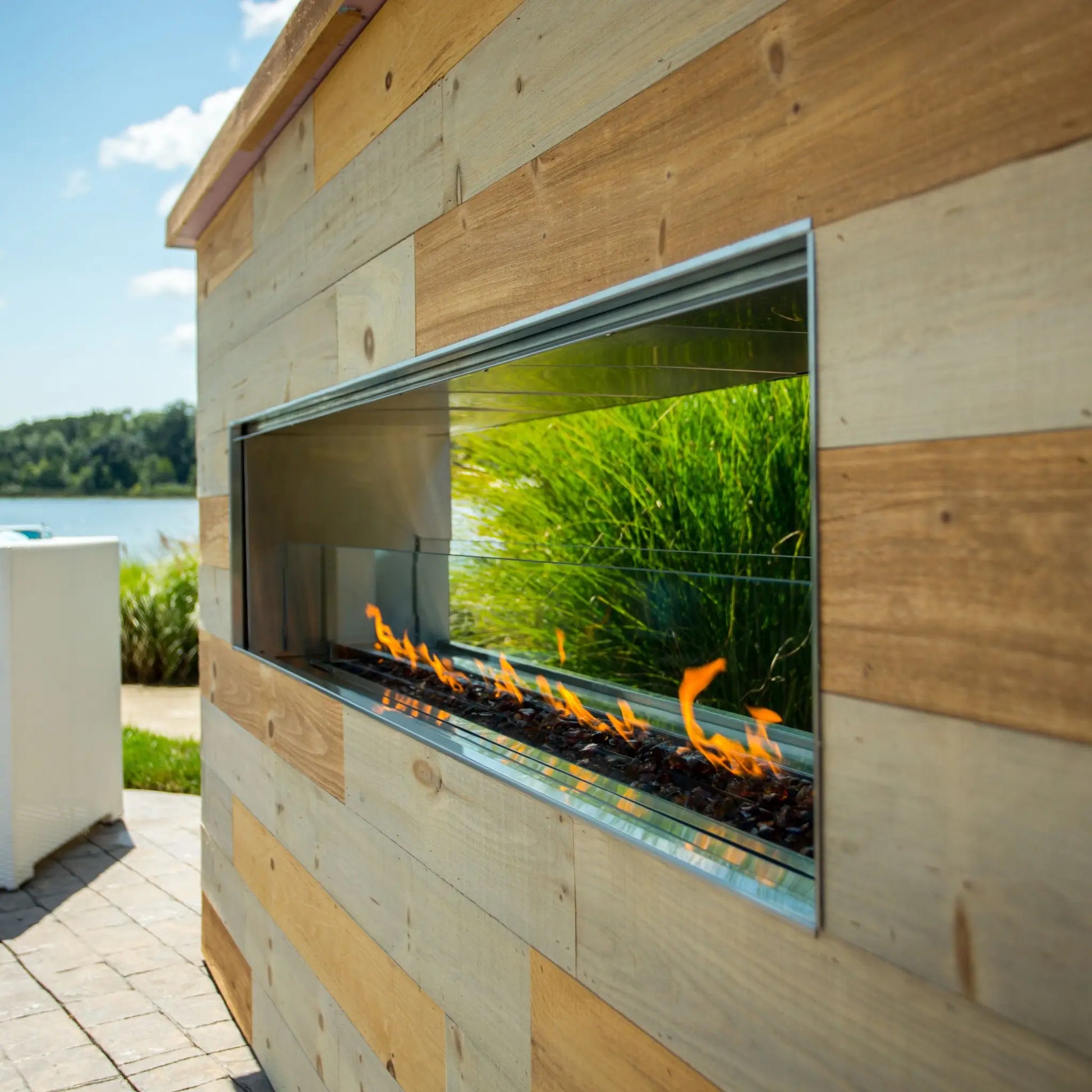 Fire Gear Kalea Bay Outdoor Linear Gas Fireplace – Evening Ambiance View