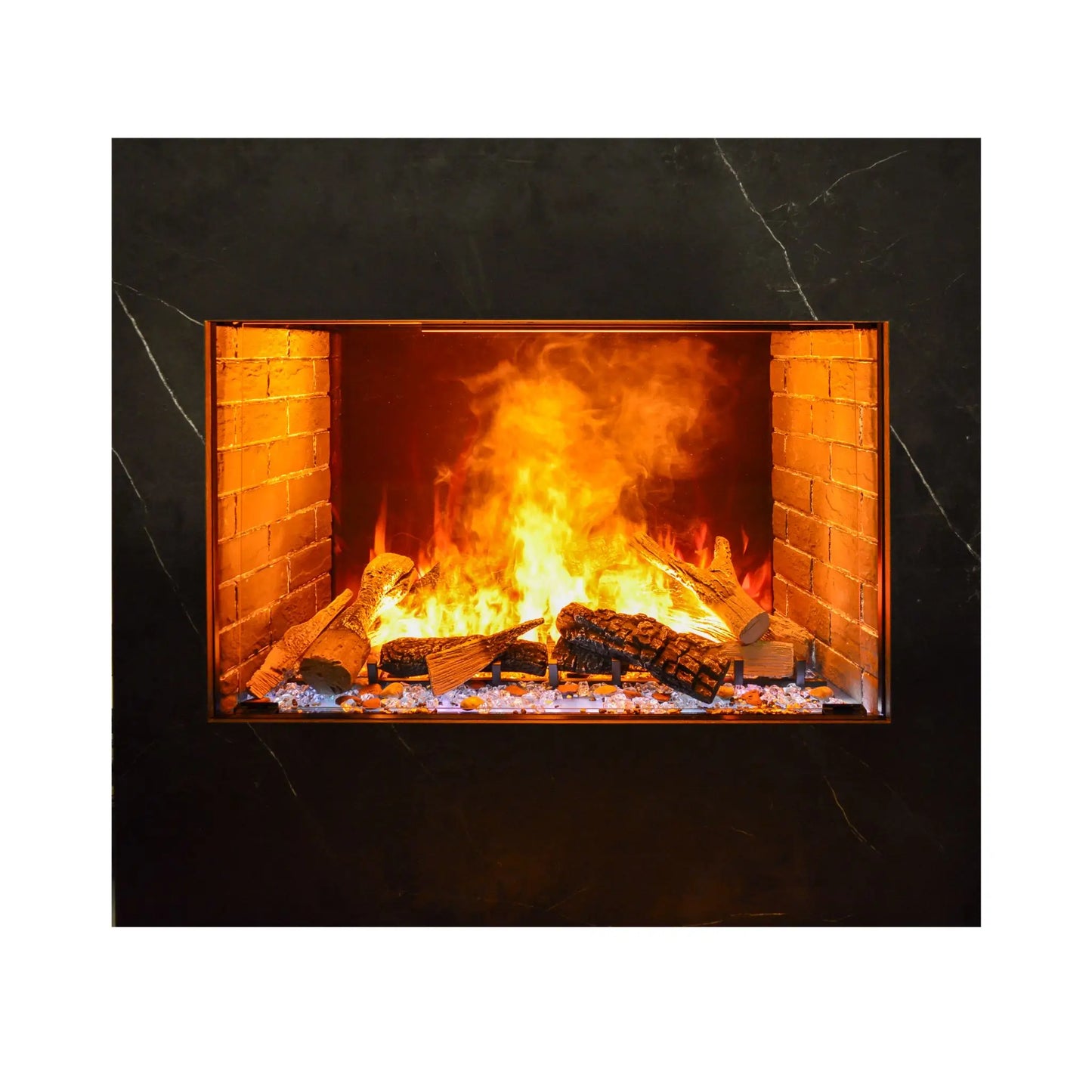 Studio product photo of the built-in electric fireplace insert framed in dark marble-look surround, showing the log set and orange flame effect from a straight-on angle.