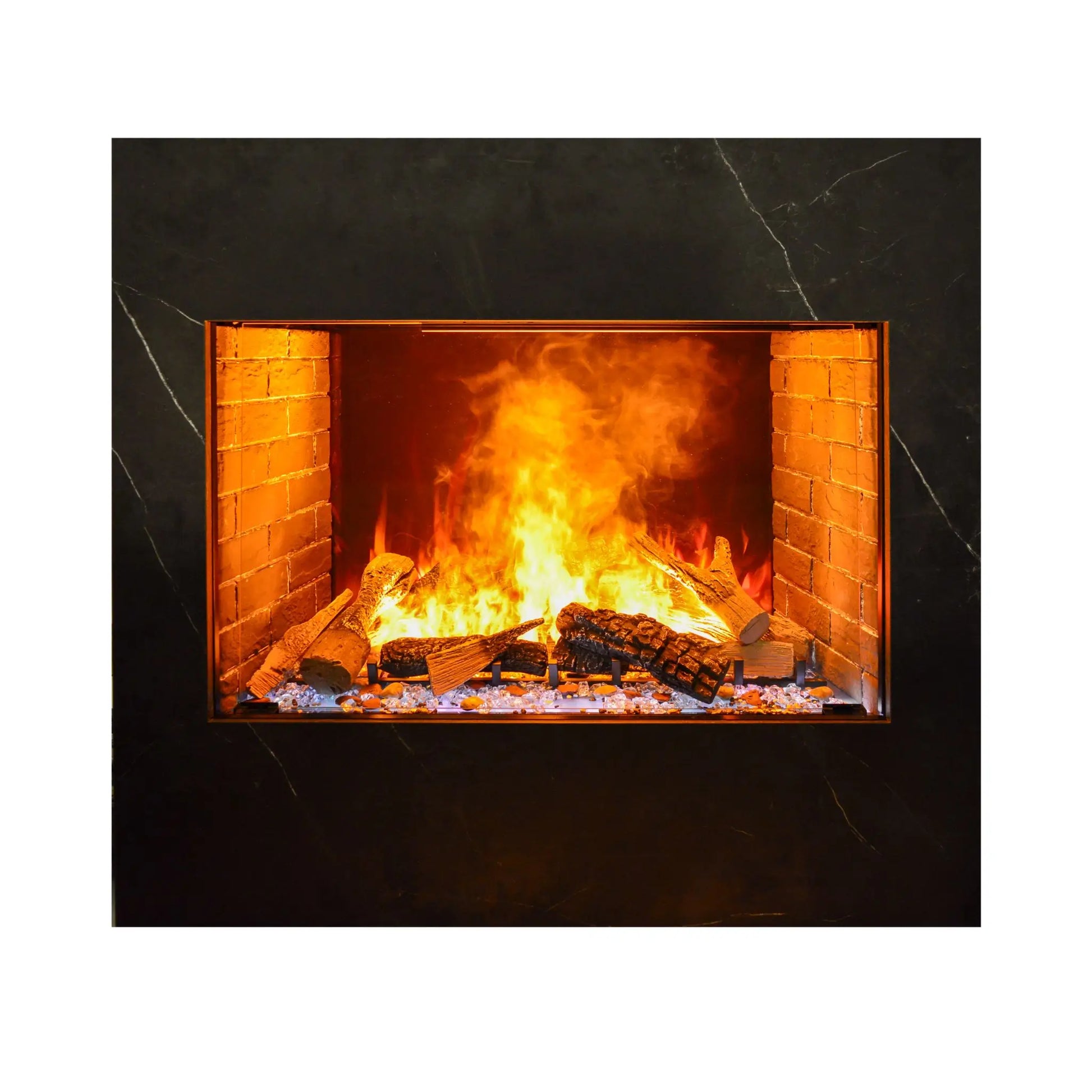 Studio product photo of the built-in electric fireplace insert framed in dark marble-look surround, showing the log set and orange flame effect from a straight-on angle.