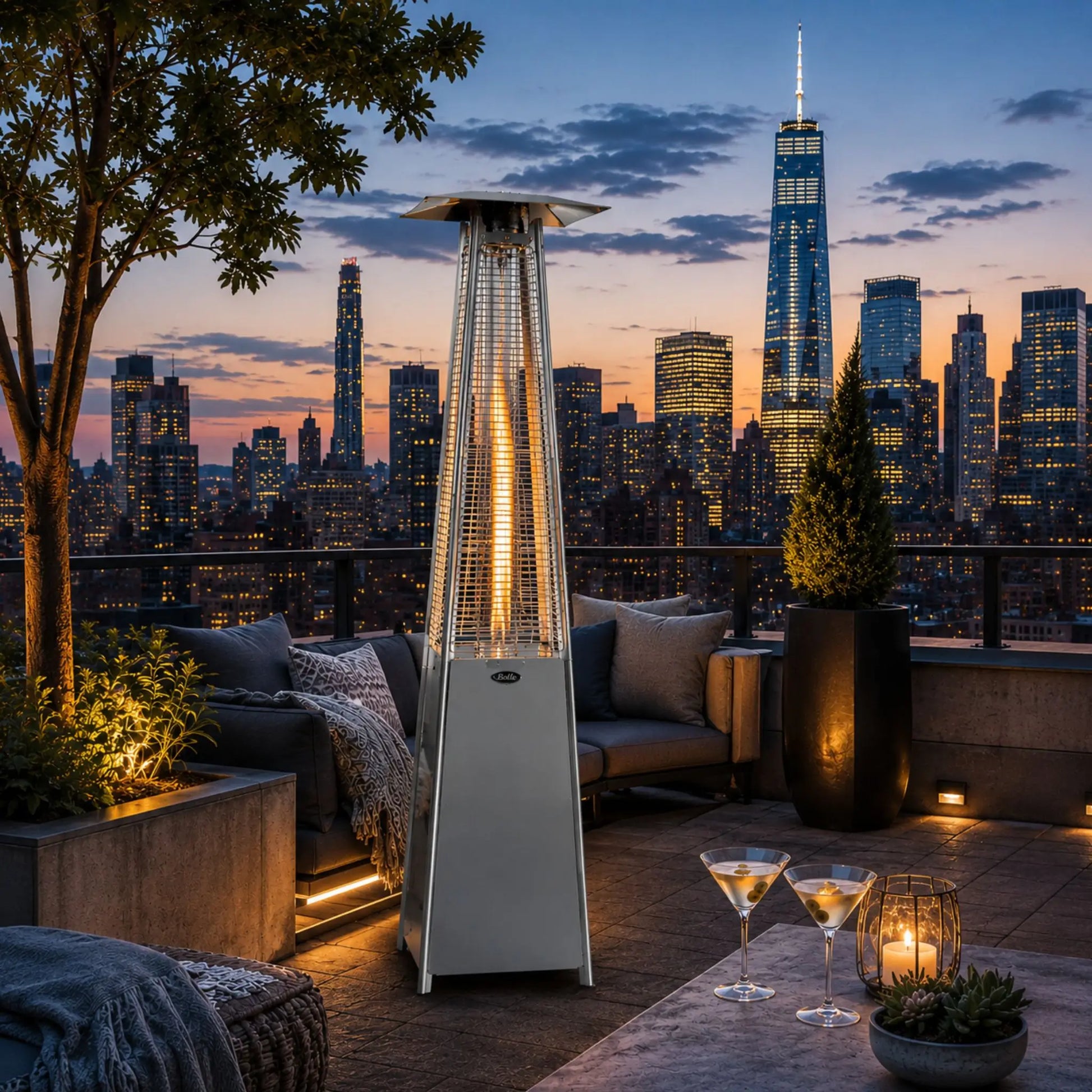 Outdoor patio with a lit heater, city skyline at dusk, and evening lights.