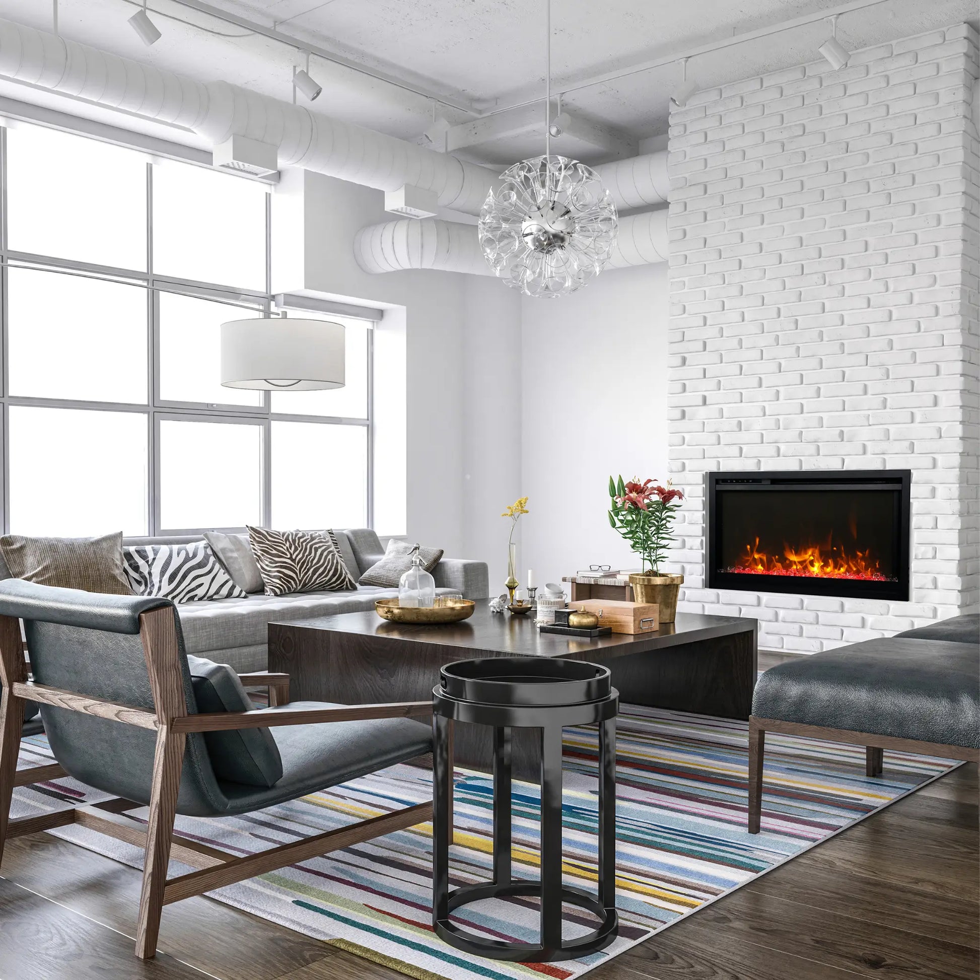 Amantii TRD Xtraslim Electric Fireplace -  Black Finish Front View
Modern living room with gray sofa, armchair, coffee table, and white brick 
wall.
