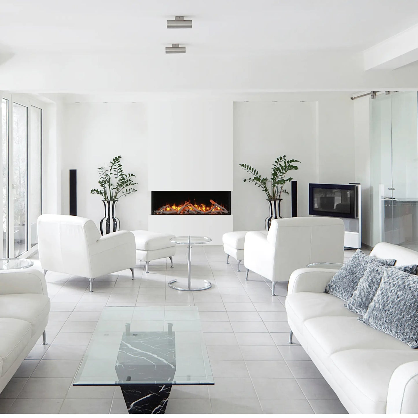 Amantii Tru View Slim Electric Fireplace -  Black Finish Front View
Modern living room with white furniture, glass coffee table, and fireplace.
